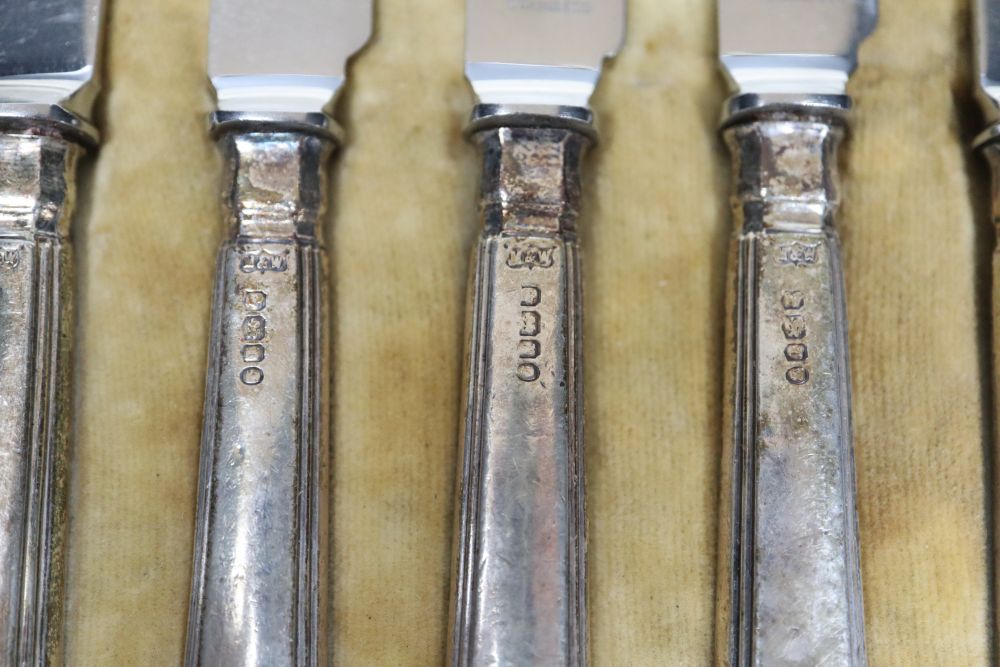 A cased set of six pairs of George V silver handled dessert eaters, Mappin & Webb, Sheffield 1934.